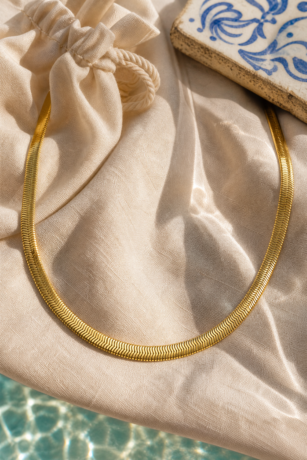 Riviera herringbone necklace flat lay