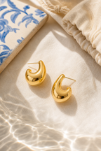 Furore dome earrings flat lay