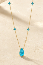 Marea blue water-droplet wave necklace in silver tone