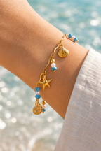 Ocean charm bracelet on the wrist