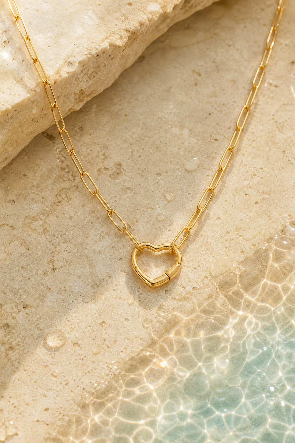 Water on the gold carabiner necklace