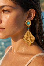 Water beading on the gold drop earrings