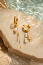 Water on the gold earrings