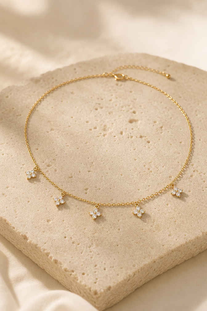 Fiorella flower charm choker on travertine stone