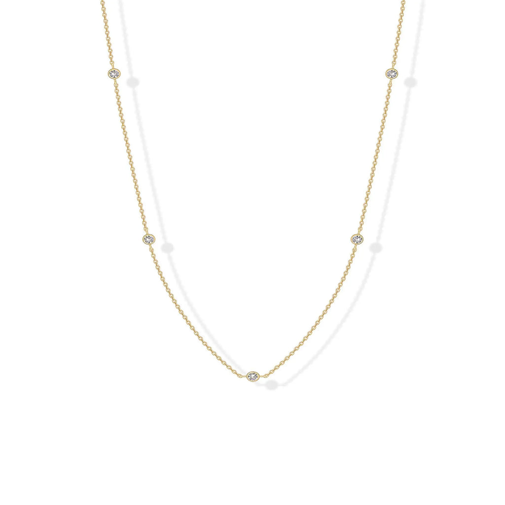 Stellina station necklace in yellow gold, full length on white