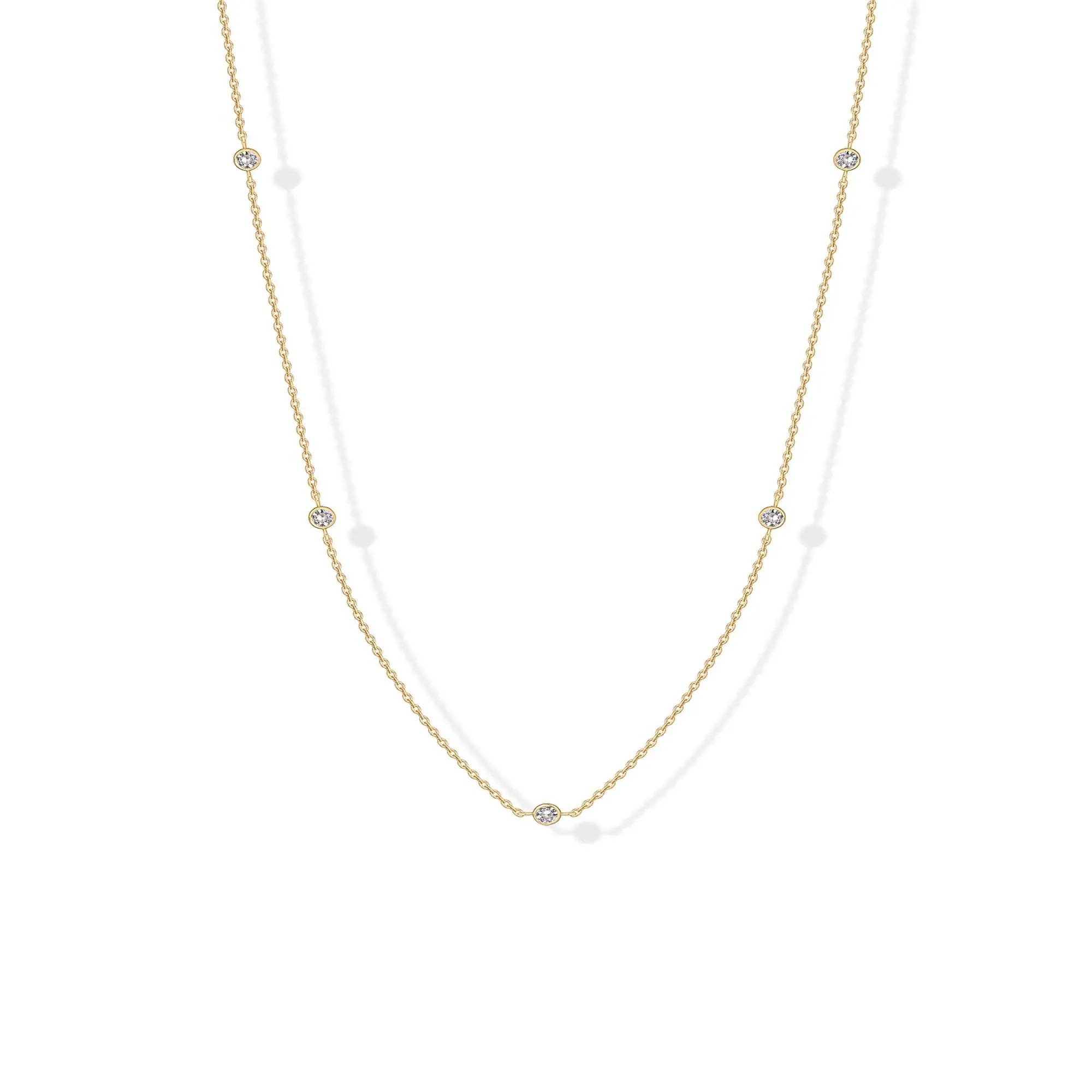 Stellina station necklace in yellow gold, full length on white