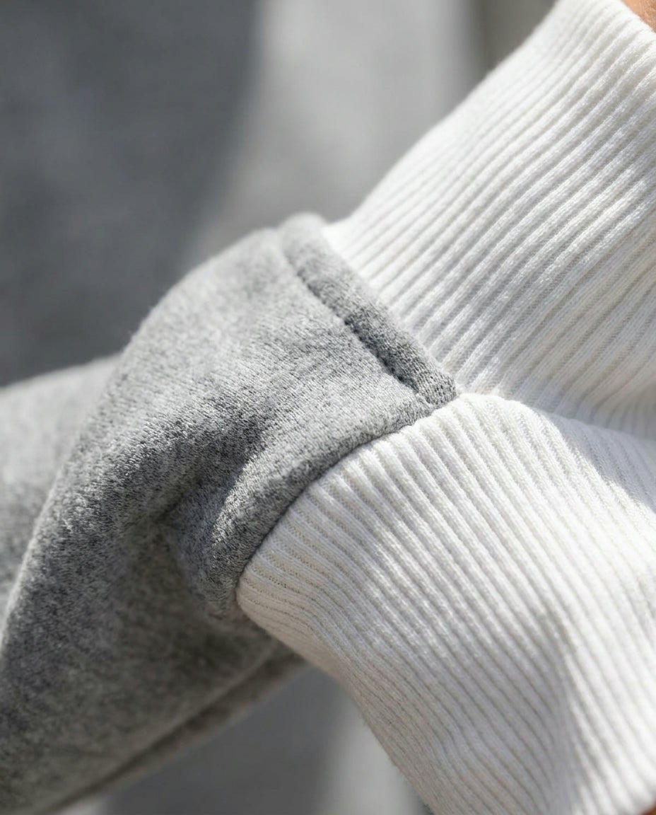 Bruma layered sweatshirt white ribbed cuff close up