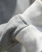 Bruma layered sweatshirt white ribbed cuff close up