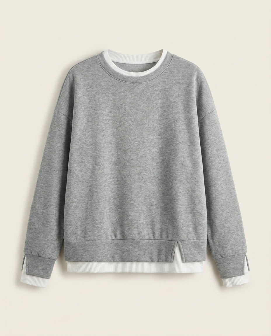 Bruma layered sweatshirt on a plain off-white background