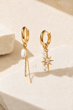 Scala asymmetrical pearl and zircon earrings in gold