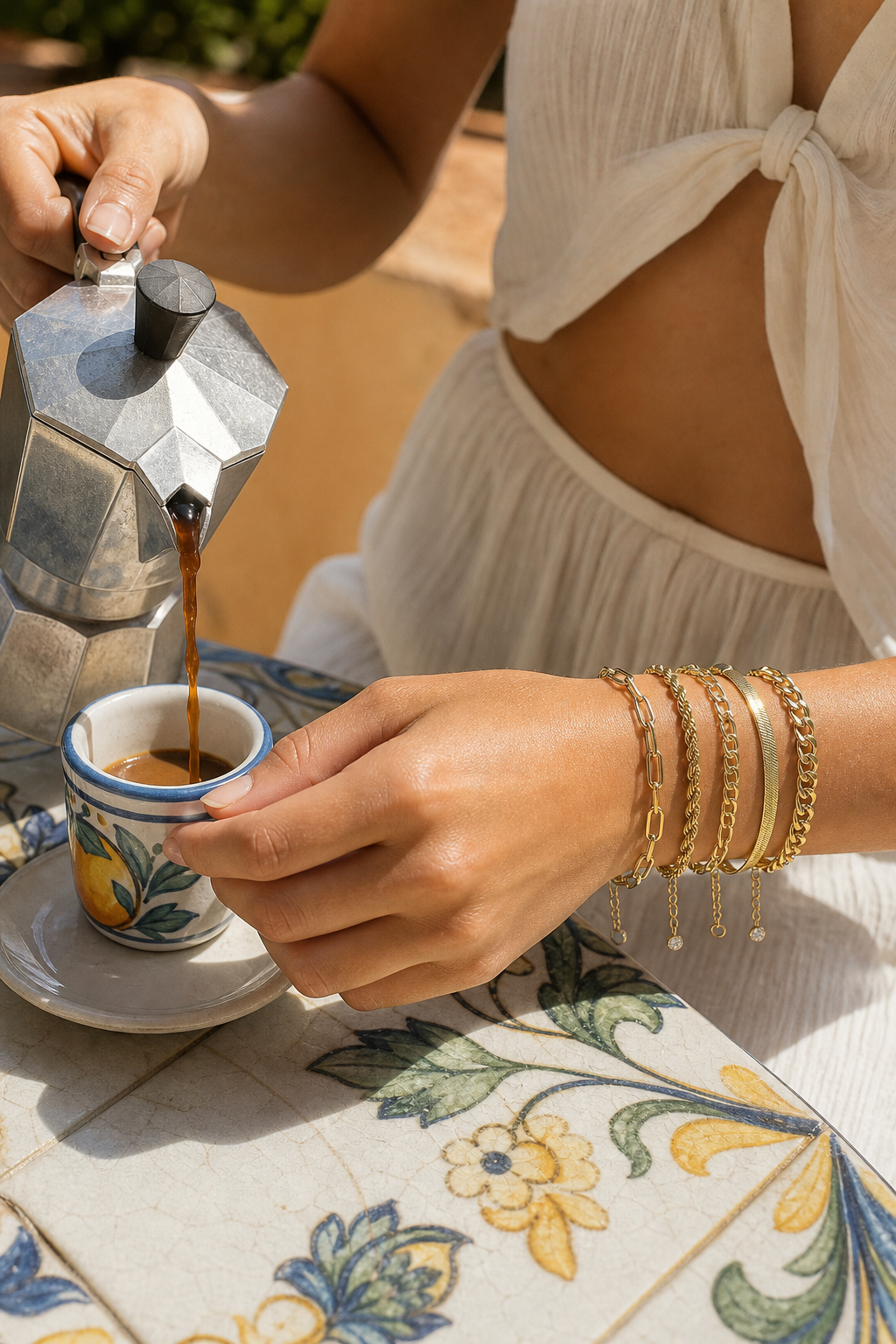 Gold bracelet stack while pouring espresso