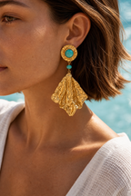 Turquoise drop earrings worn, sunlit