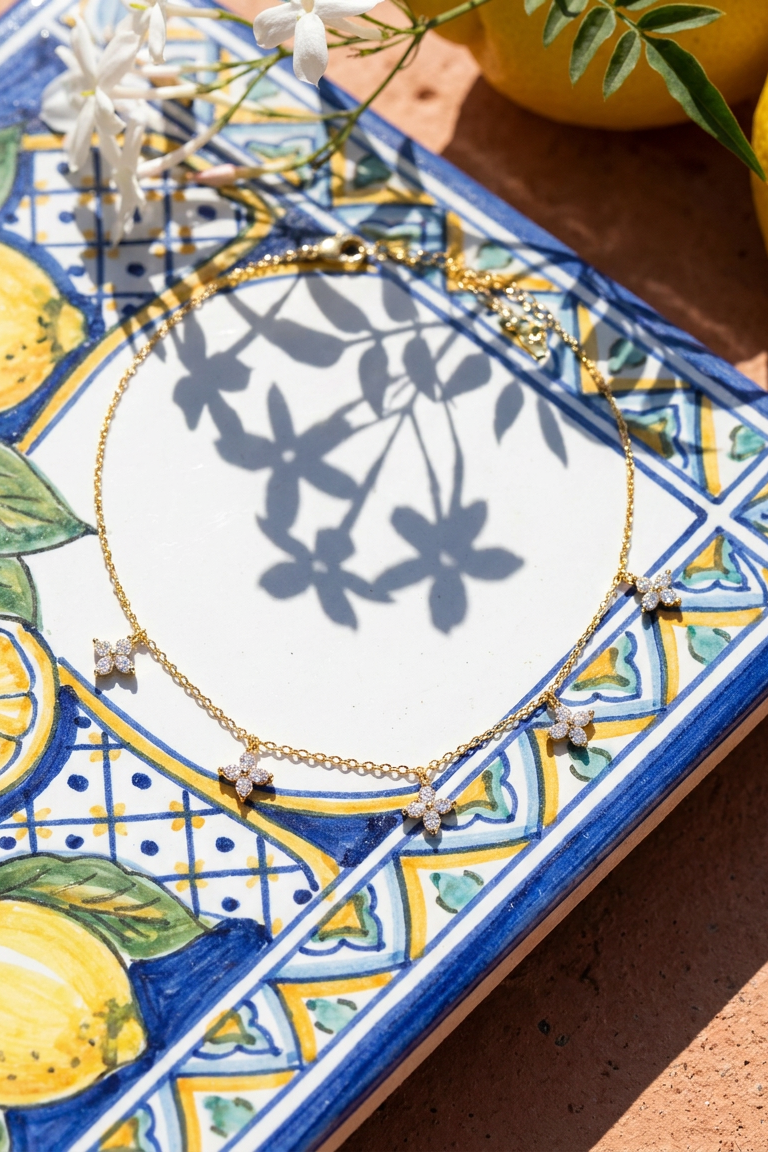 Fiorella choker on a majolica tile with lemons