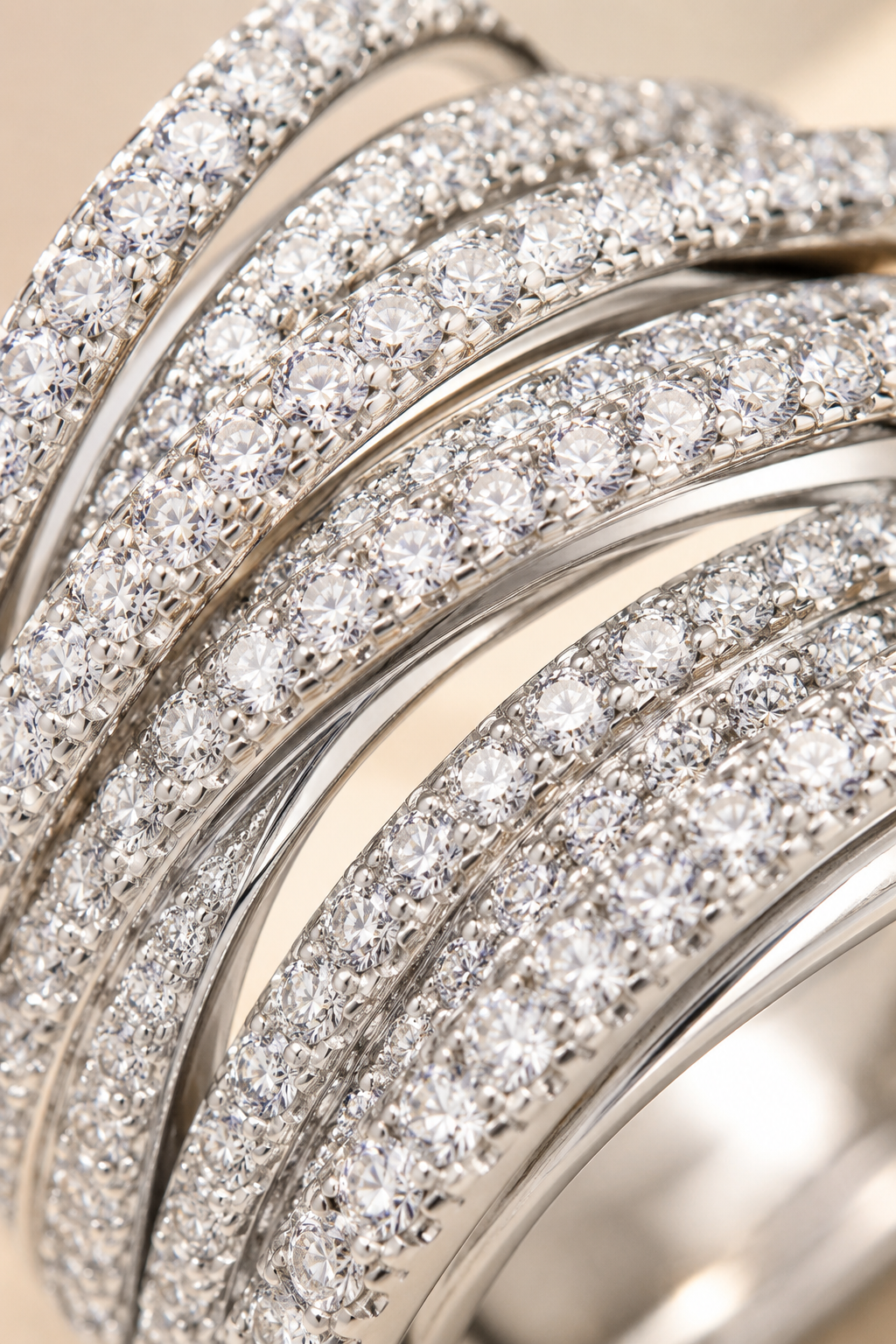 Macro of the Abbraccio crossing pave bands showing rows of tiny crystal stones