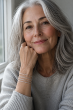 Silver-haired woman wearing the Sei silver bracelet stack