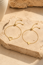 Sorella heart bracelet set, both bracelets on travertine stone