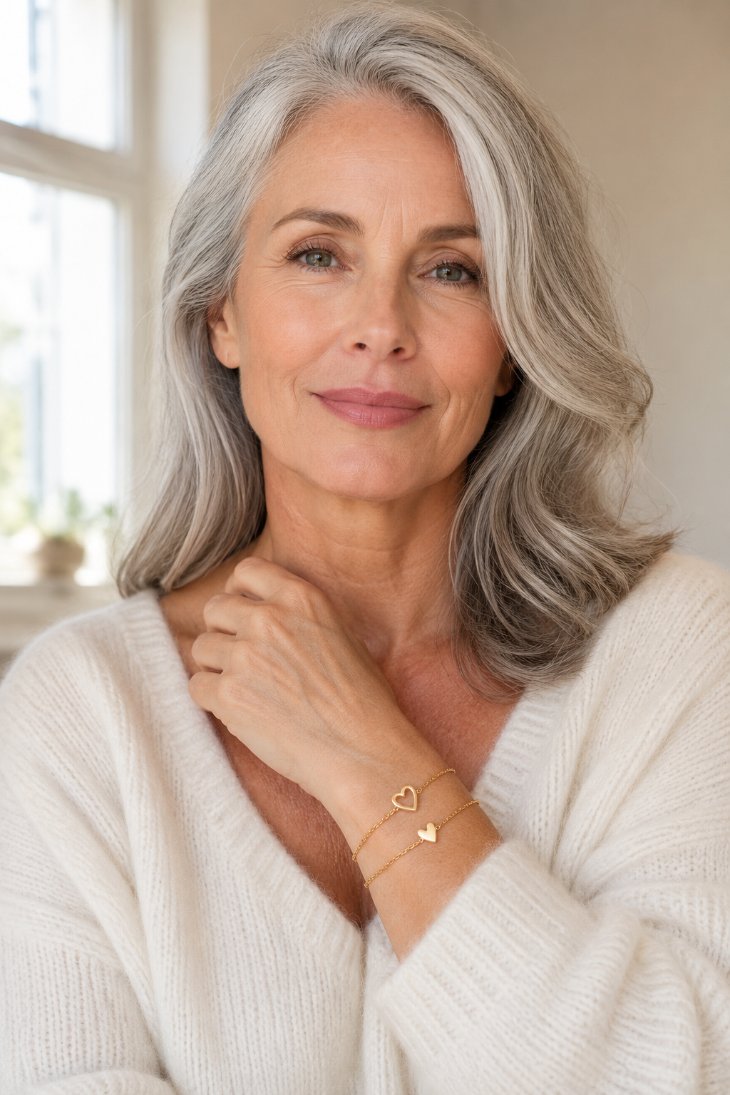 Woman wearing the open heart bracelet at her collarbone