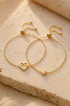 Macro of the solid heart and open heart charms side by side
