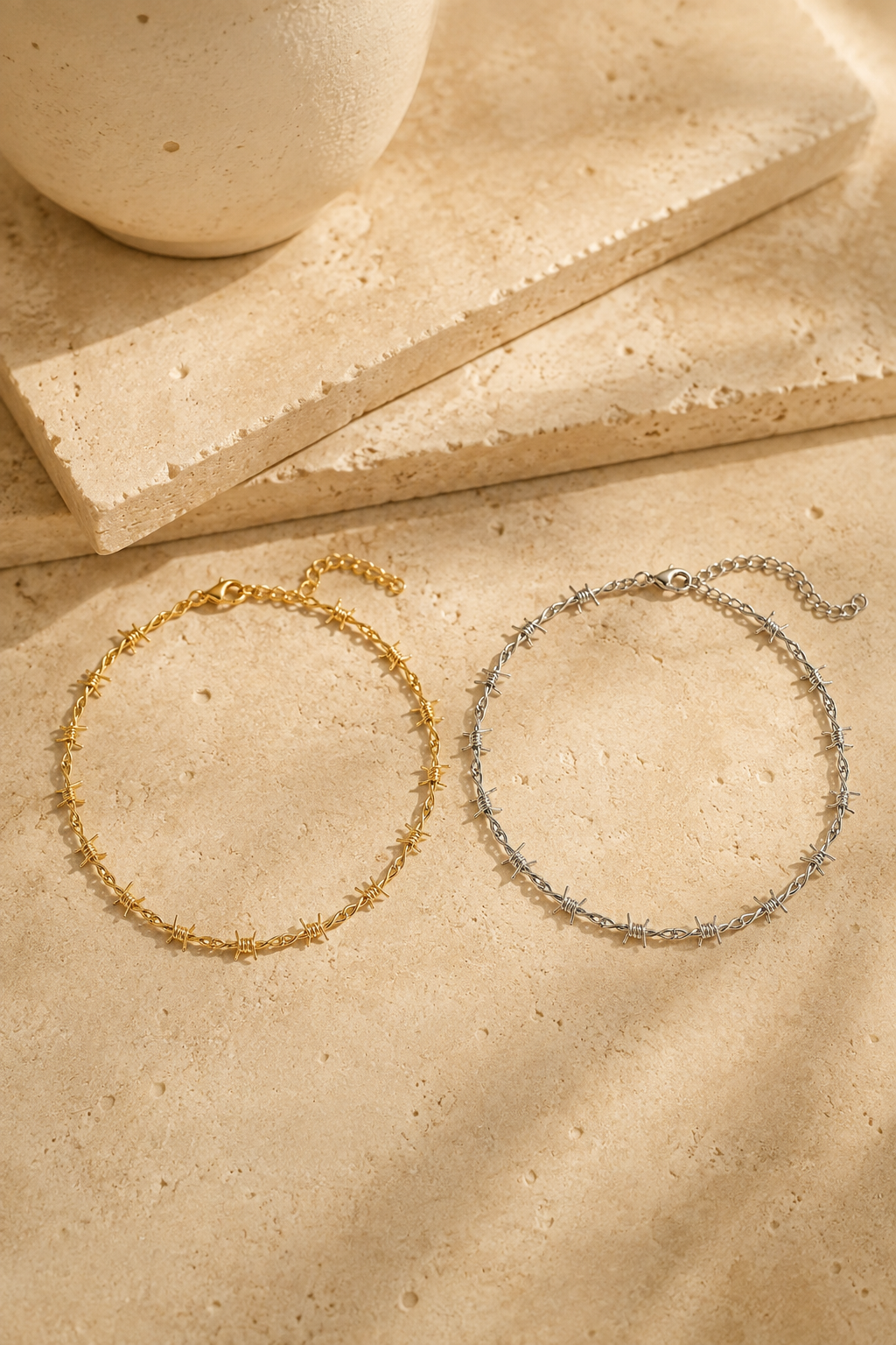 Spina barbed choker in gold and silver side by side