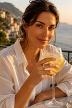 Woman holding a lemon spritz wearing the Lettera initial ring