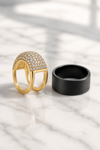 Cupola cover beside a plain black smart ring