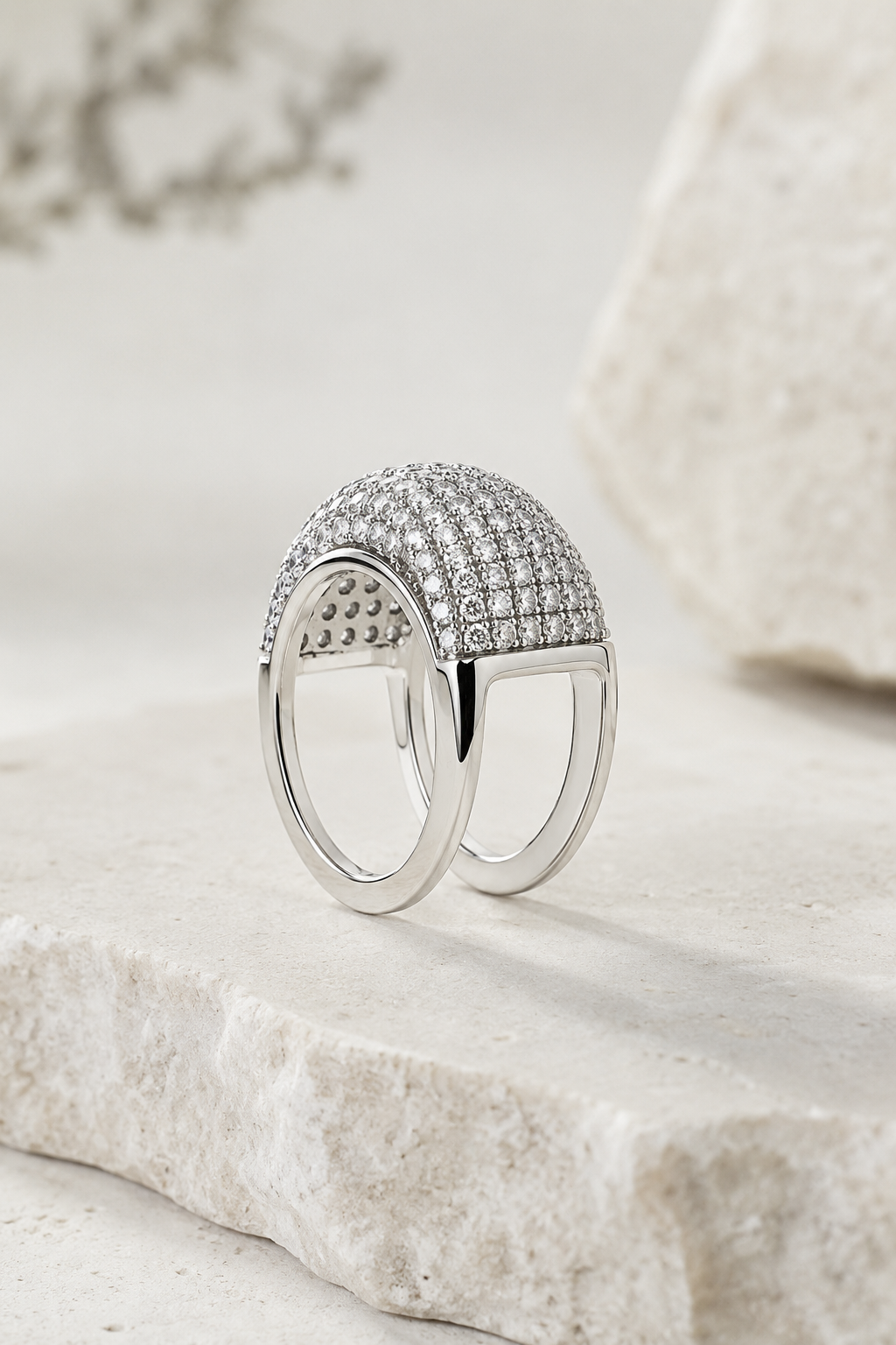 White gold Cupola pave ring cover on limestone