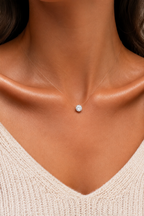 Goccia floating crystal necklace worn at the collarbone