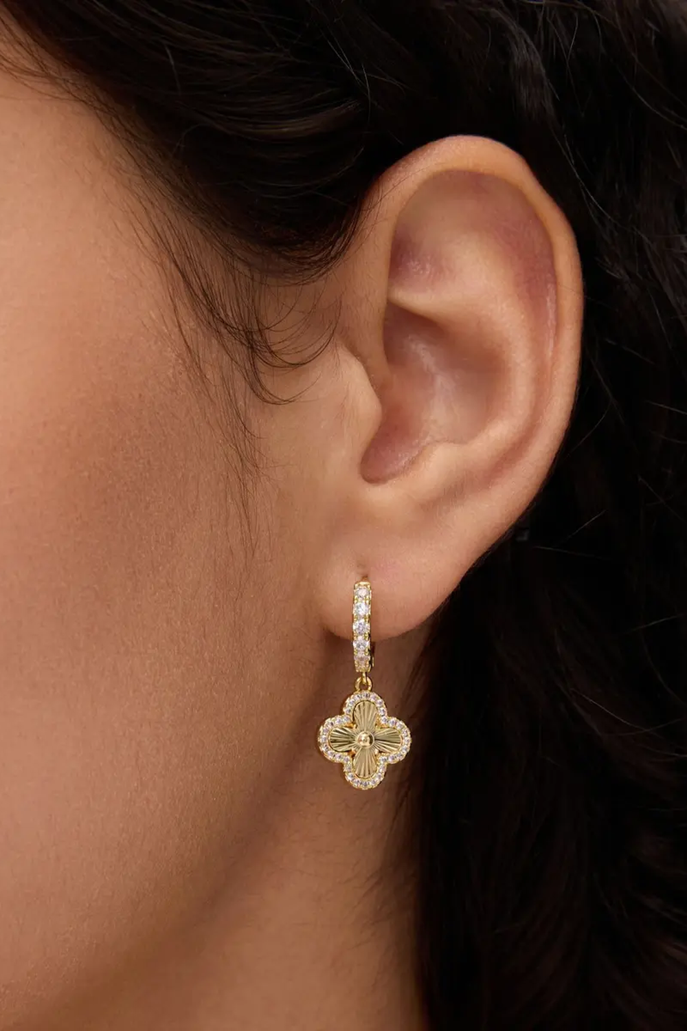Fortuna clover earring worn on the lobe