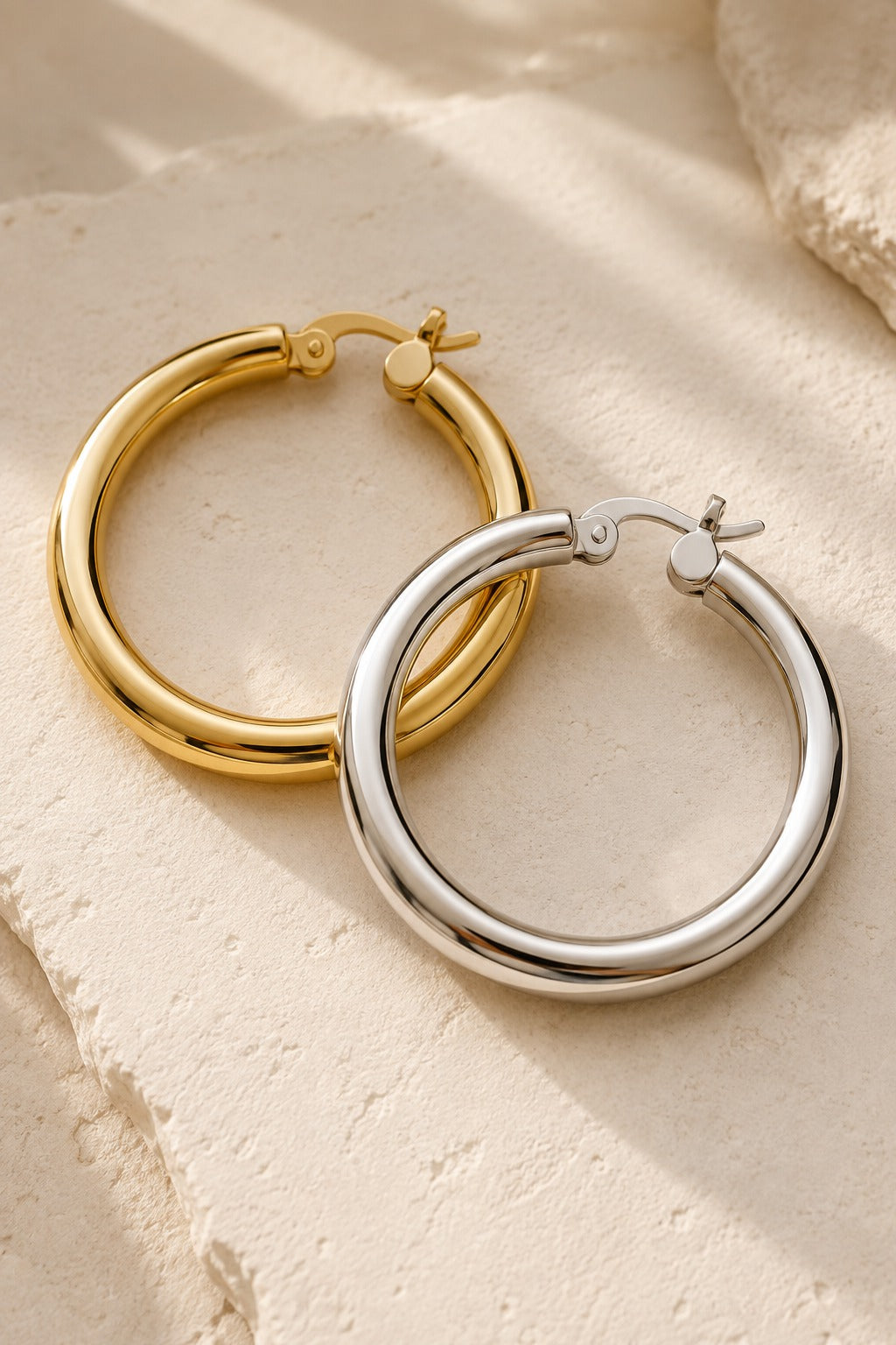Ischia chunky tube hoops in gold and silver side by side