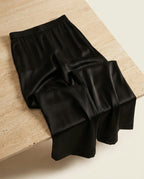 Luna satin pant on warm travertine stone