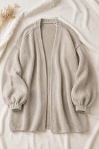 Nuvola oversized open-front cardigan laid flat on cream linen