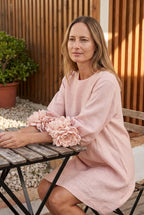 Petalo puff sleeve dress in pink, seated