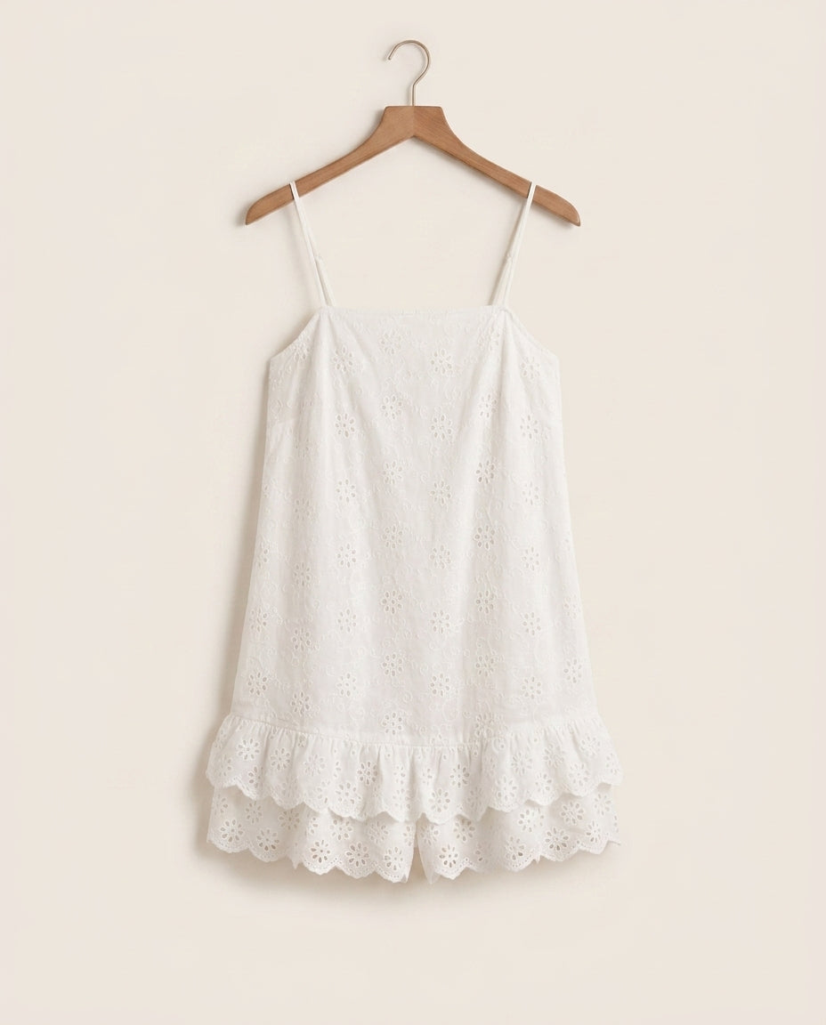 Praiano eyelet romper on a plain off-white background