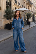 Salerno denim jumpsuit in blue, worn with hands in pockets