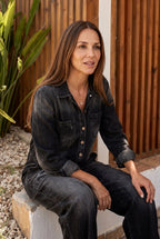 Salerno denim jumpsuit in black, seated