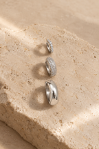 Scala hoop trio, three pairs of silver hoops on limestone
