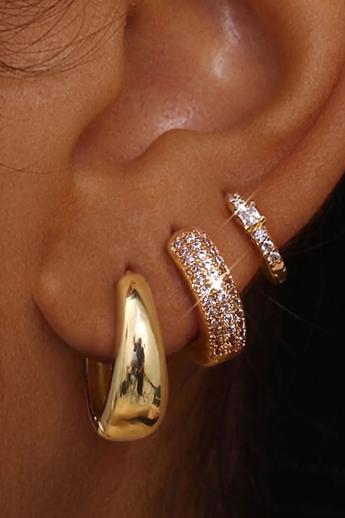 Scala hoop trio, Classic Gold, worn on the ear
