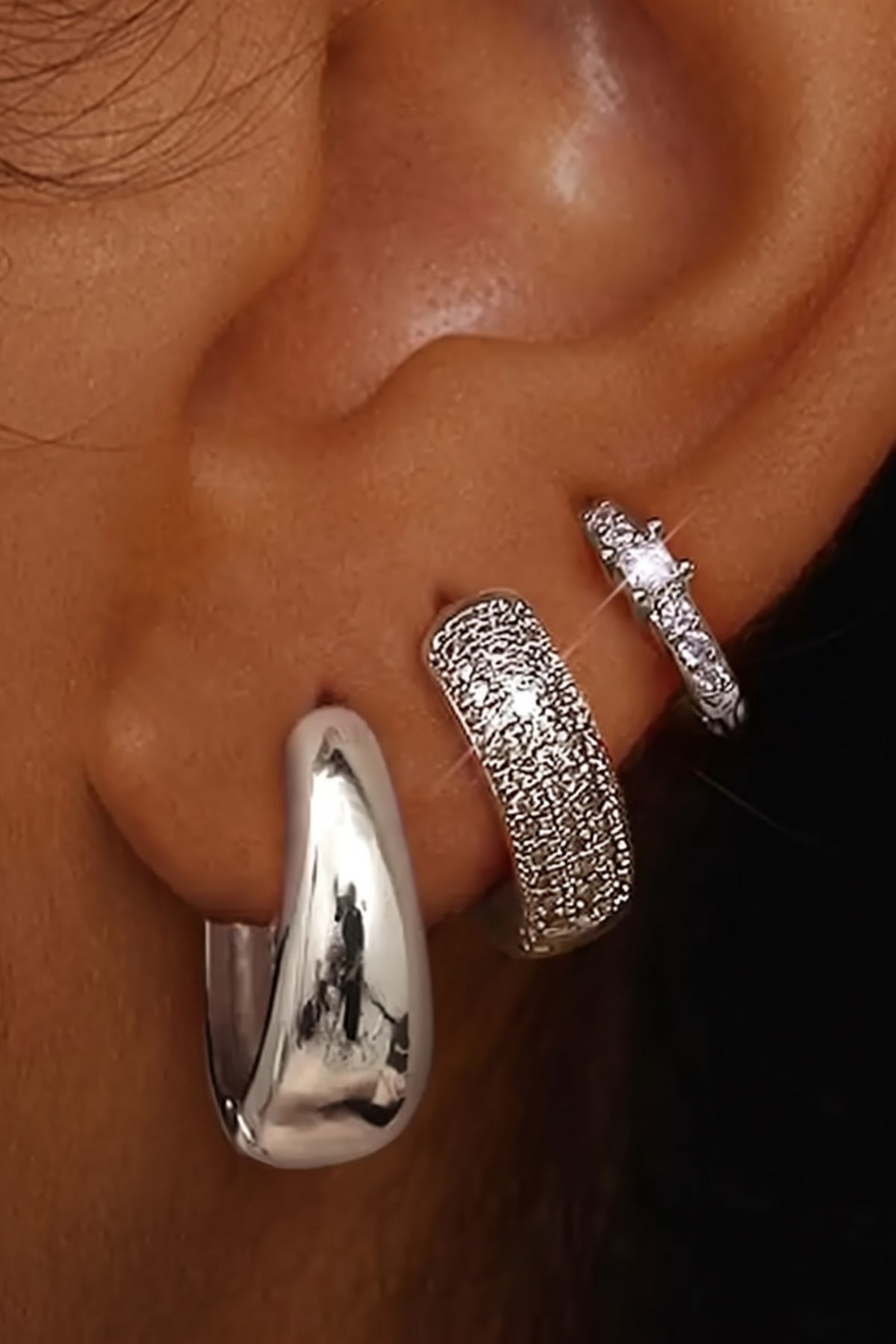 Scala hoop trio, Classic Silver, worn on the ear