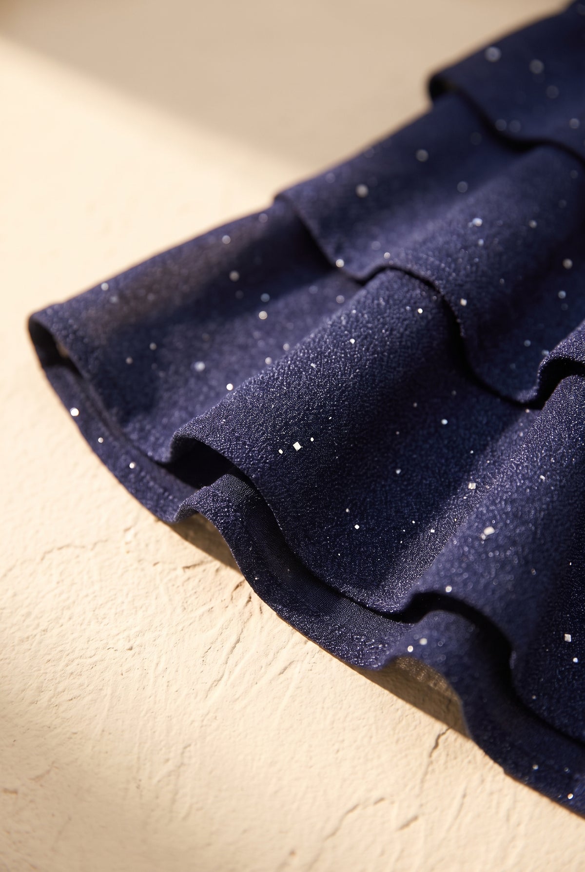 Scintilla dress, shimmer fabric and ruffle hem detail
