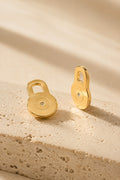 Solleva gold lobe lifter earring backs on warm travertine stone