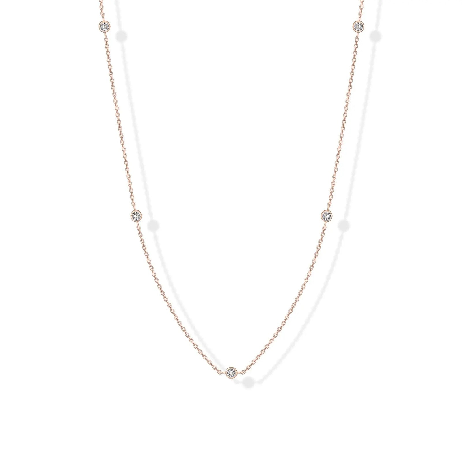 Stellina station necklace in rose gold, full length on white