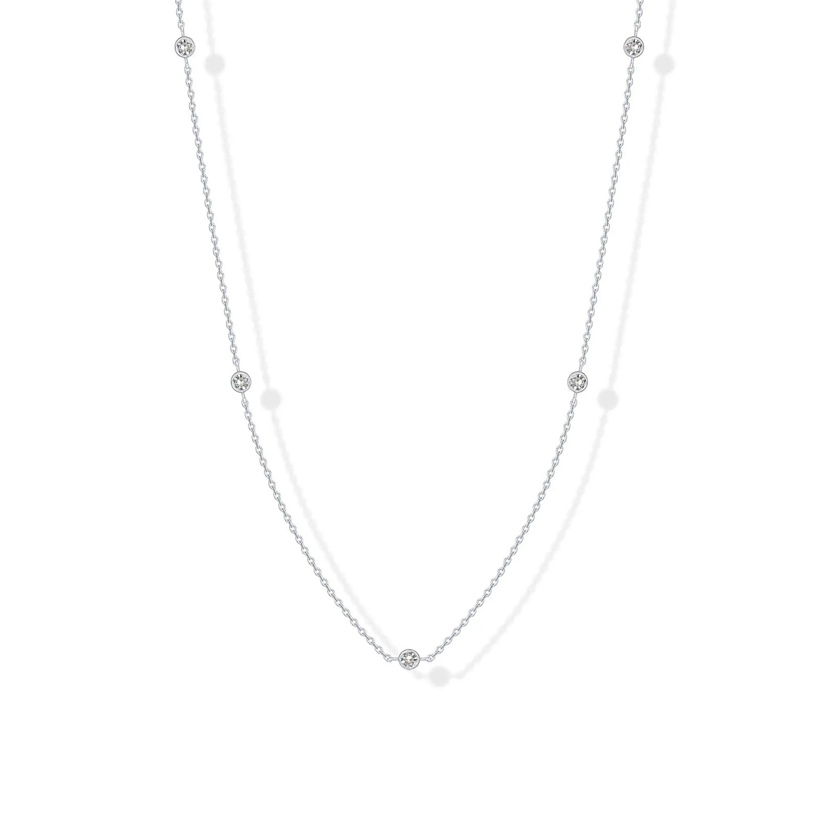 Stellina station necklace in white gold, full length on white