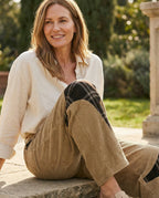 Woman seated wearing the Vietri barrel pant